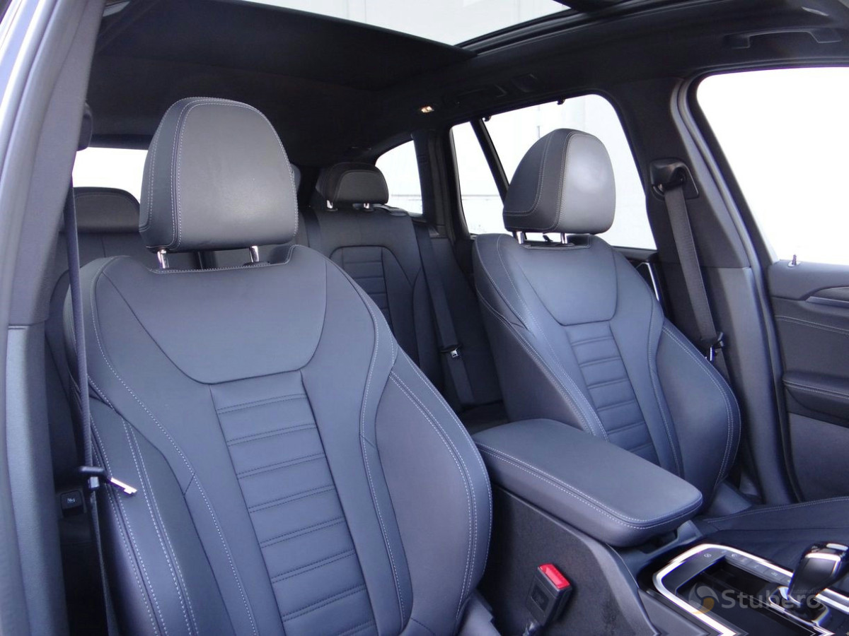 The front seats and their upholstery inside this vehicle.